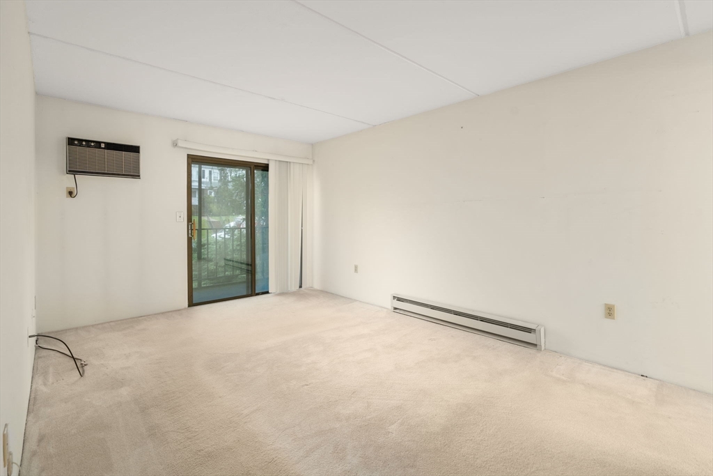 190 High Street, Unit 409 Medford, MA 02155 - Photo 20 of 30 a view of an empty room with a window