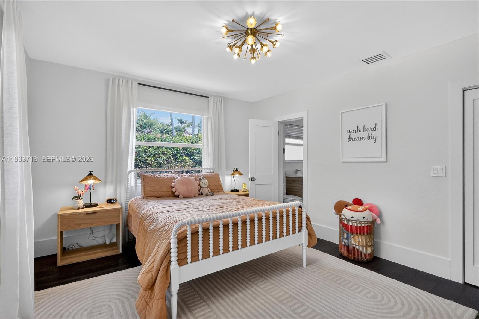 3258 Riviera Drive Coral Gables, FL 33134 - Photo 14 of 43 a bedroom with a bed and a window