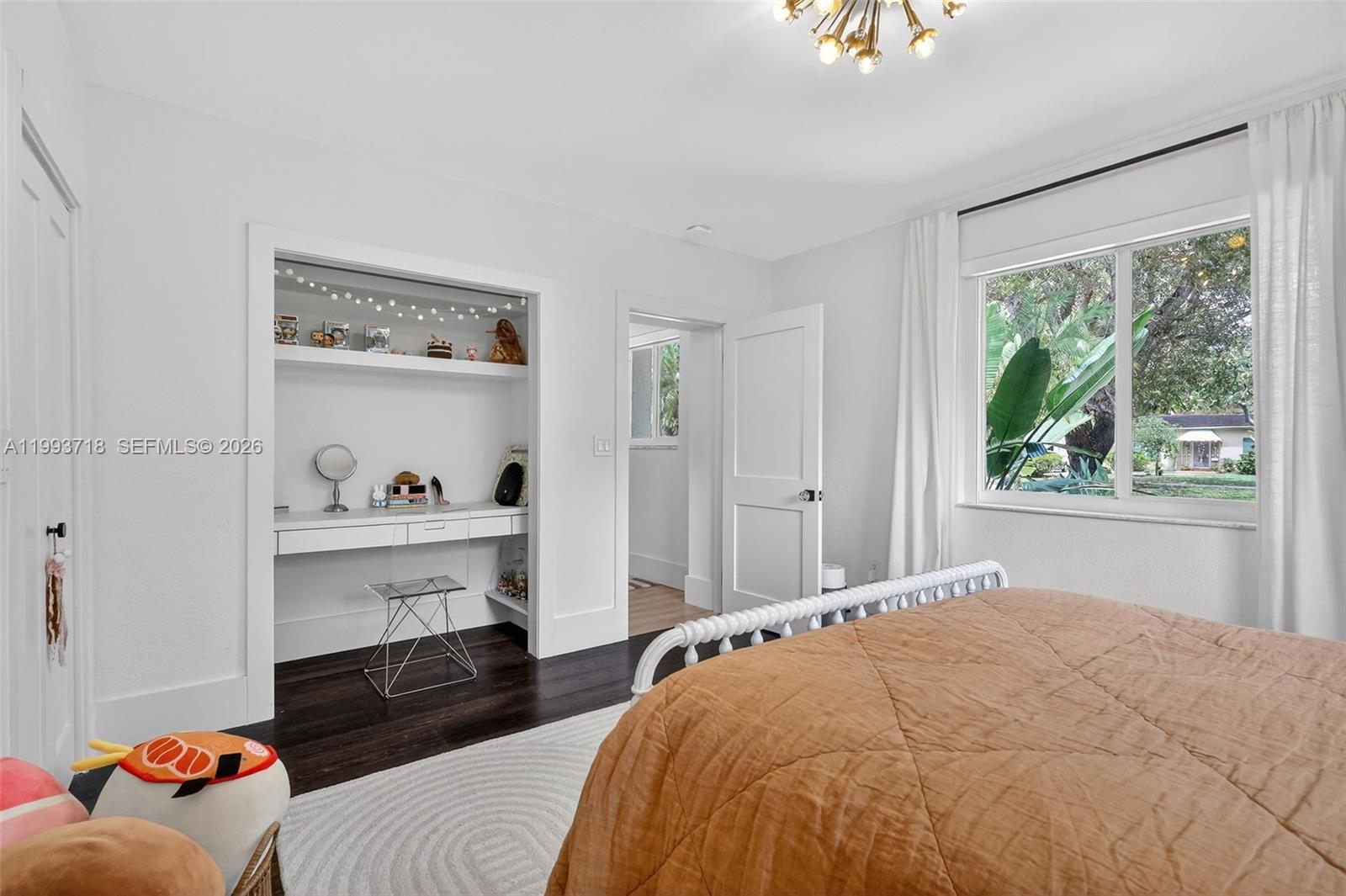 3258 Riviera Drive Coral Gables, FL 33134 - Photo 15 of 43 a bedroom with a bed and a window