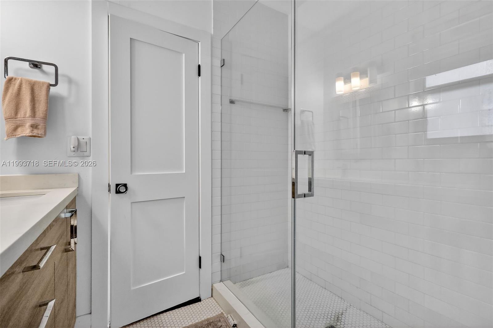 3258 Riviera Drive Coral Gables, FL 33134 - Photo 17 of 43 a bathroom with a shower and a sink