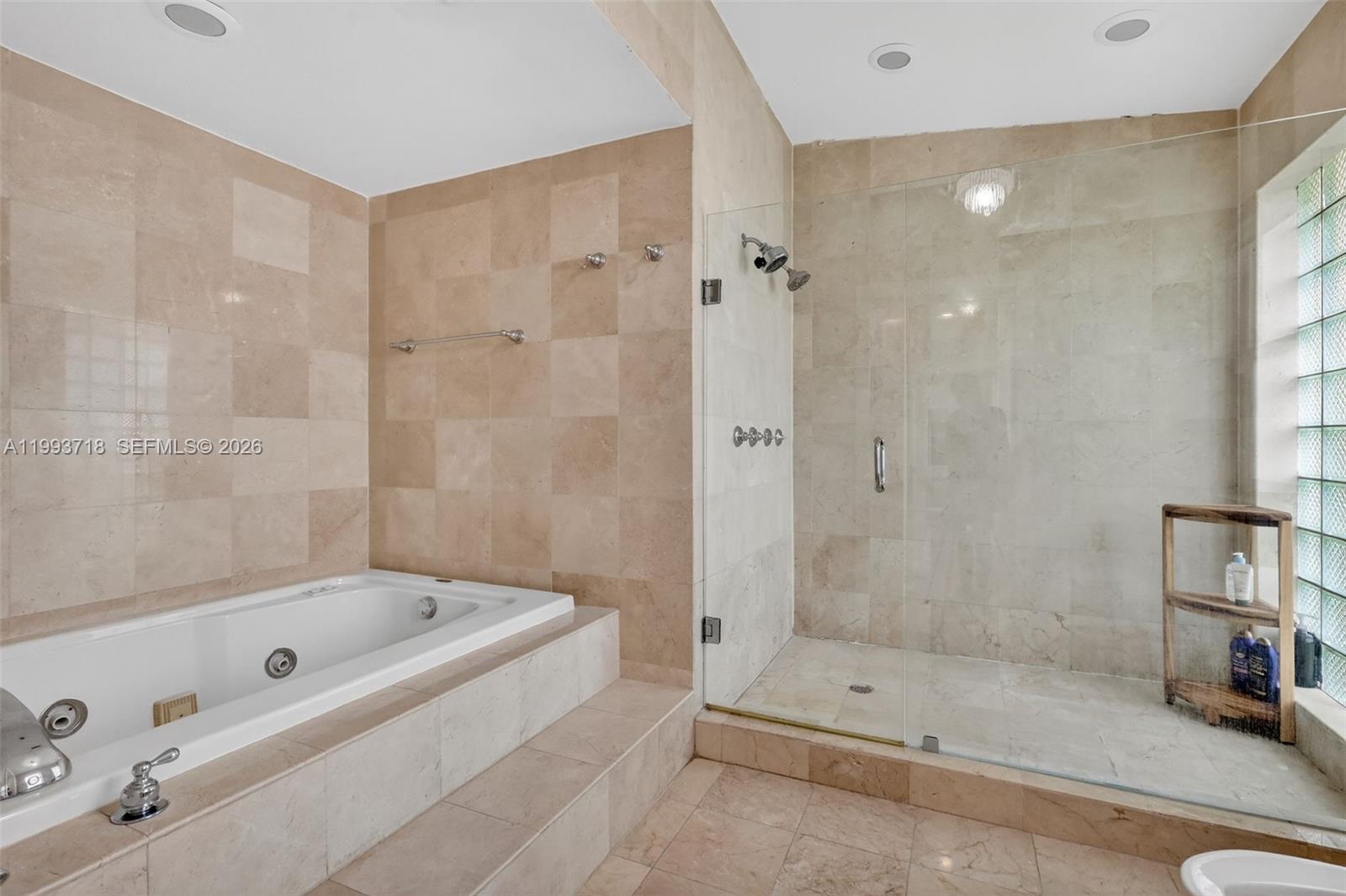 3258 Riviera Drive Coral Gables, FL 33134 - Photo 25 of 43 a bathroom with a tub and a shower