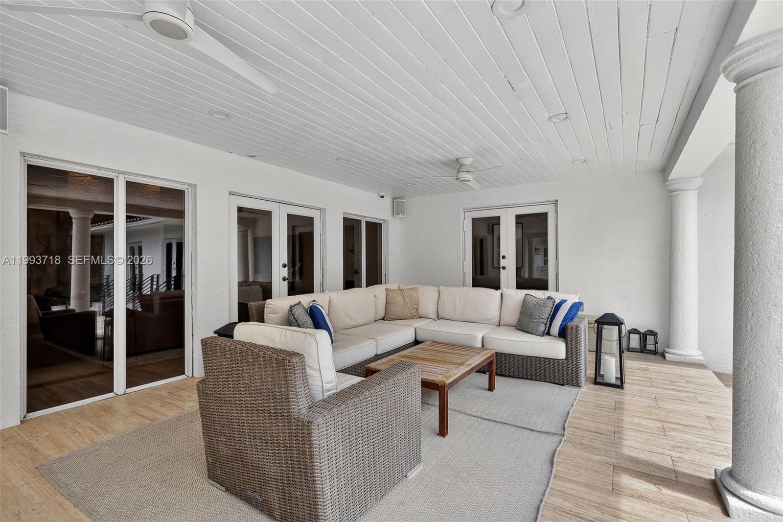 3258 Riviera Drive Coral Gables, FL 33134 - Photo 30 of 43 a living room with furniture and a potted plant