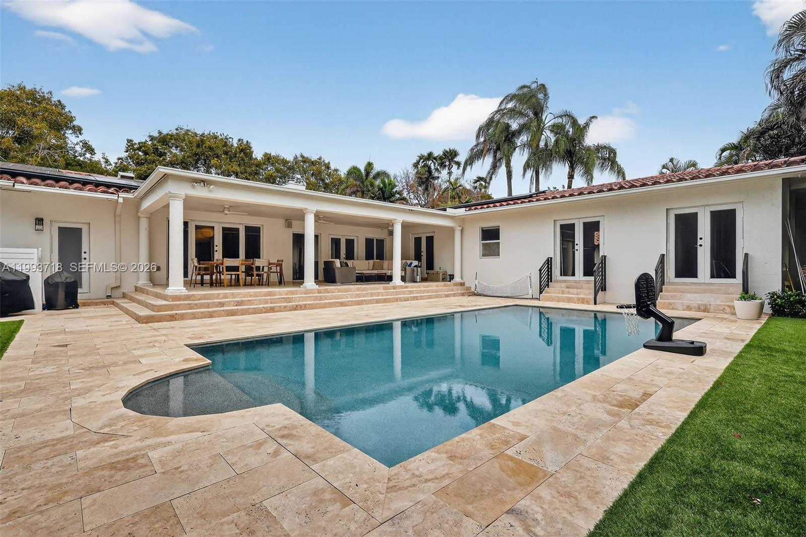 3258 Riviera Drive Coral Gables, FL 33134 - Photo 3 of 43 a view of a house with swimming pool
