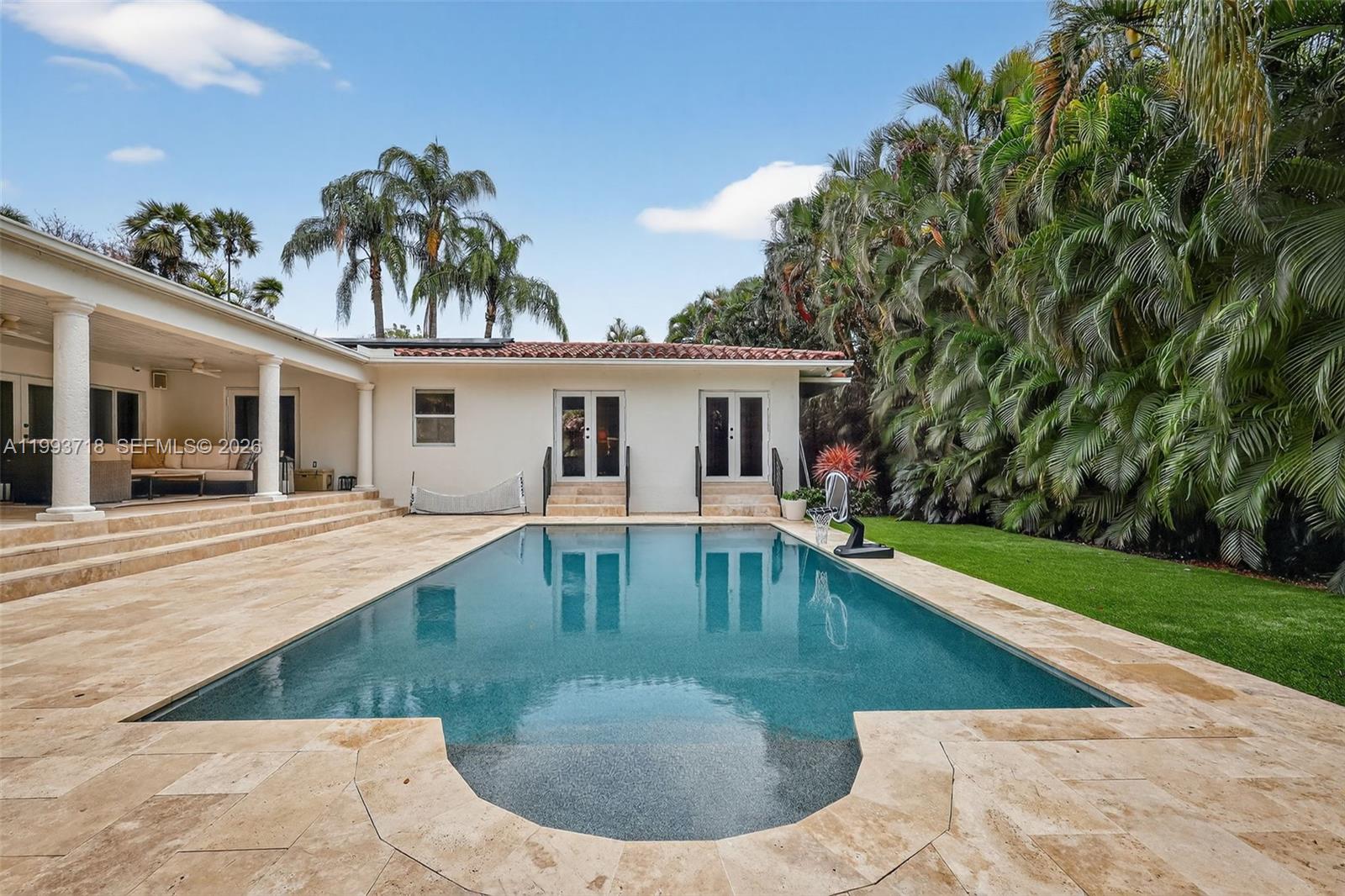 3258 Riviera Drive Coral Gables, FL 33134 - Photo 32 of 43 a view of a house with swimming pool