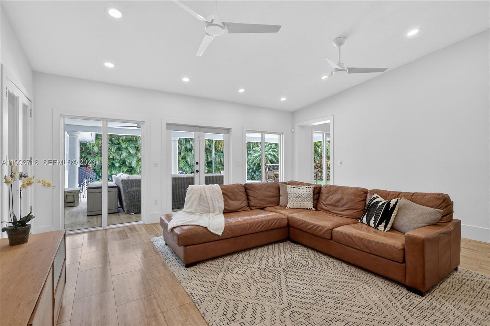 3258 Riviera Drive Coral Gables, FL 33134 - Photo 7 of 43 a living room with furniture and a large window