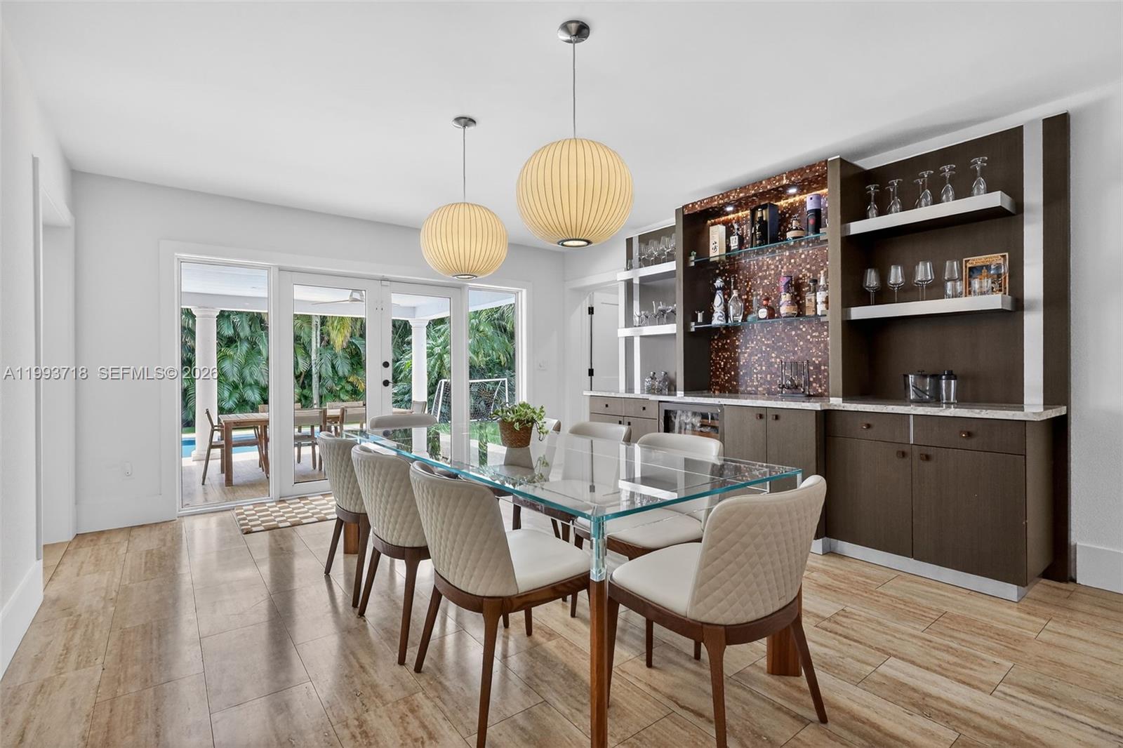 3258 Riviera Drive Coral Gables, FL 33134 - Photo 9 of 43 a dining room with furniture and window