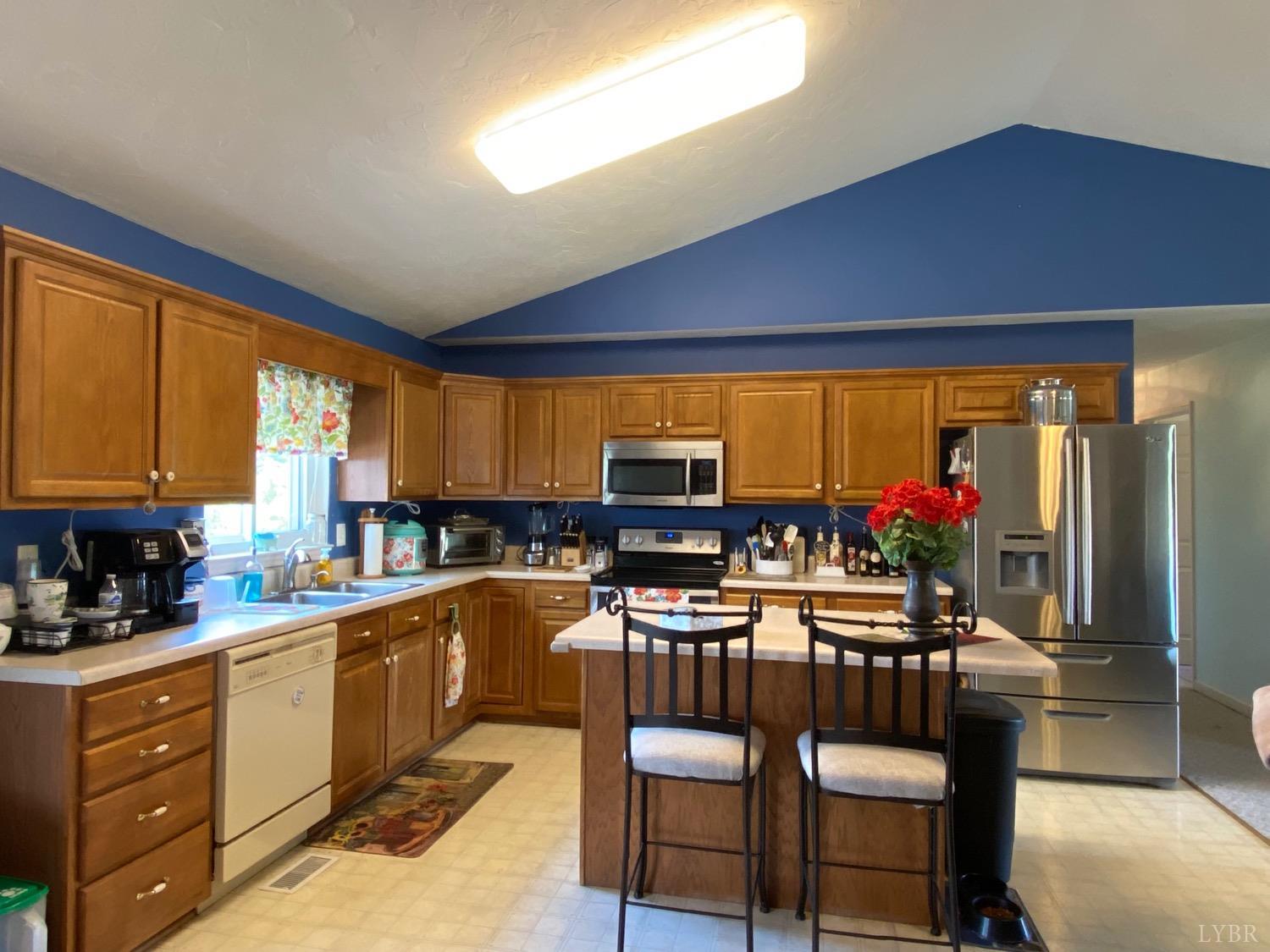1149 Emmaus Church Road Moneta, VA 24121 - Photo 15 of 51 a kitchen with lots of counter top space and dining table