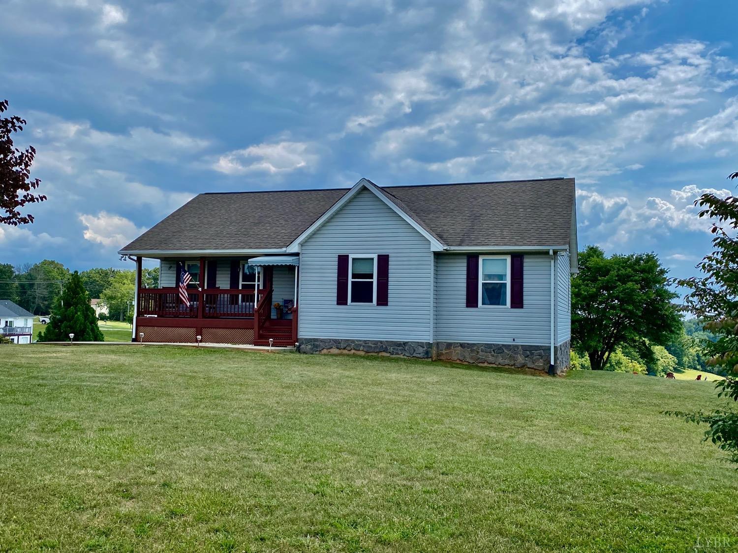 1149 Emmaus Church Road Moneta, VA 24121 - Photo 2 of 51 a front view of a house with a garden and yard