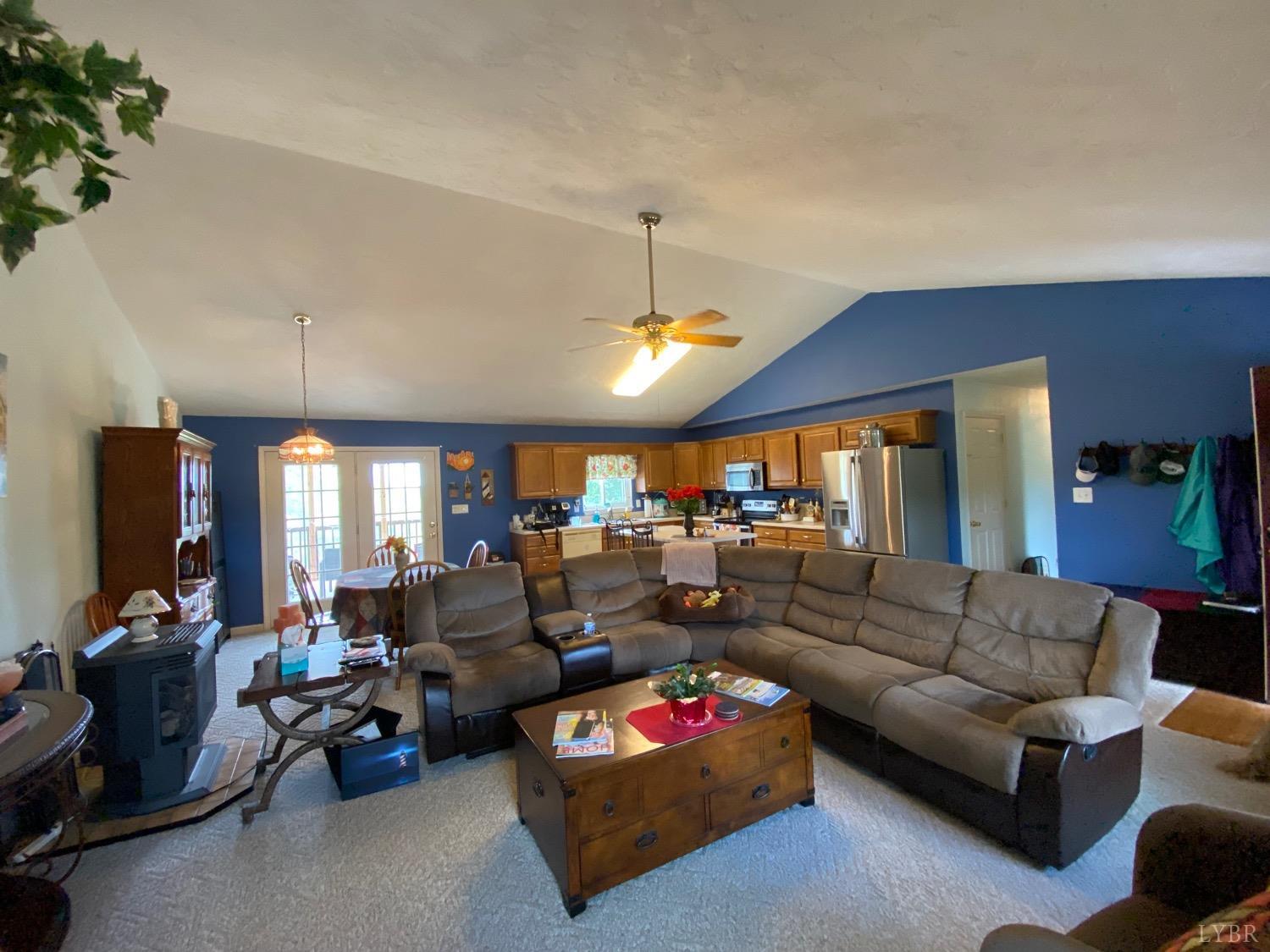 1149 Emmaus Church Road Moneta, VA 24121 - Photo 23 of 51 a living room with furniture kitchen view and a chandelier