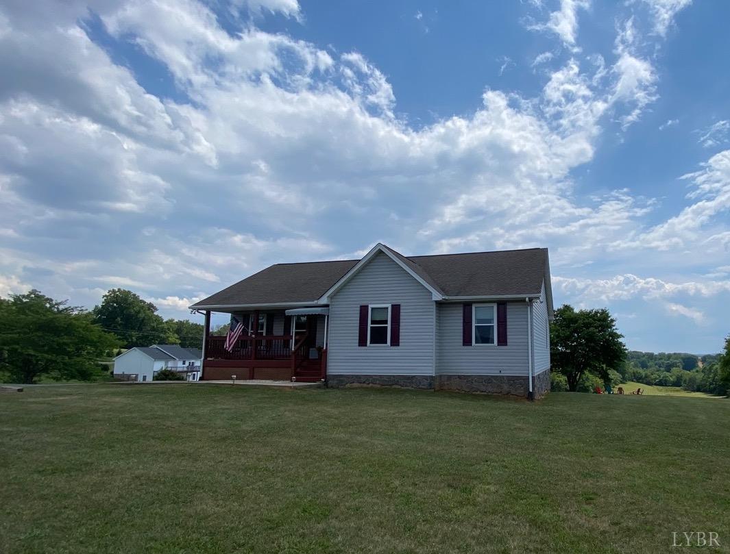 1149 Emmaus Church Road Moneta, VA 24121 - Photo 3 of 51 a view of a house with a big yard potted plants and large tree