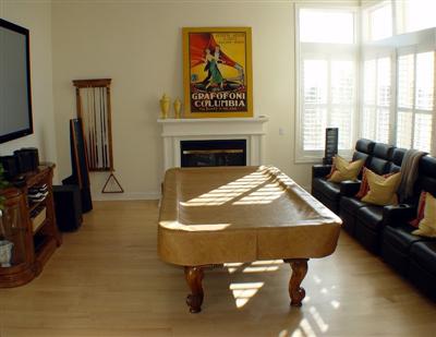 605 Arrigoni Court Santa Rosa, CA 95409 - Photo 3 of 12 Formal living room currently re-purposed as a game and media room. Note the hardwood floors!