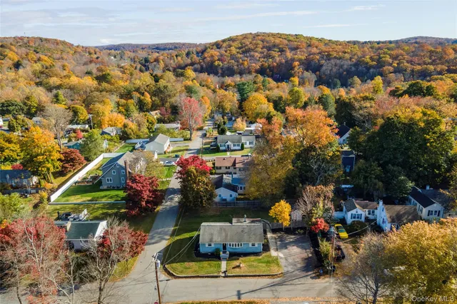 an aerial view of a house with a swimming pool