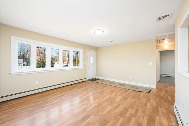 a view of an empty room with a window