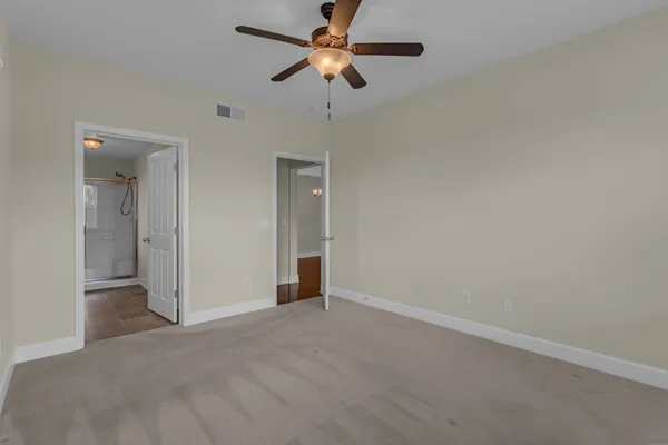 a view of a room with shelf with racks on the wall