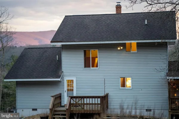 a view of a balcony with furniture