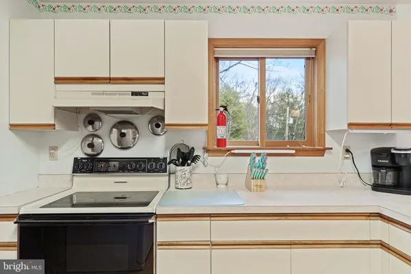 a view of front door with a furniture and a window
