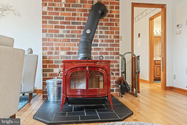 a bedroom with a bed and dresser with mirror