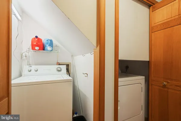 a view of a lush green hillside and a building