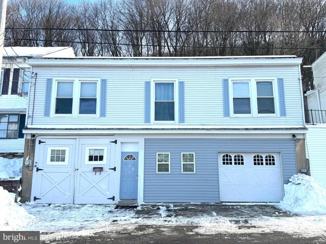 front view of a house with a street