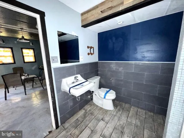 a view of a dining room with furniture and a window