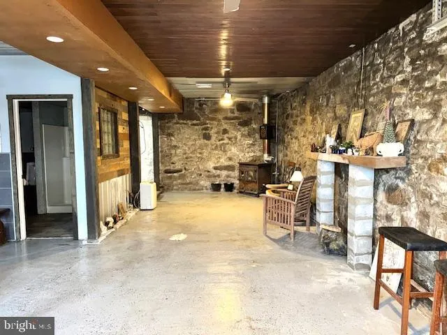 a view of living room with furniture and wooden floor