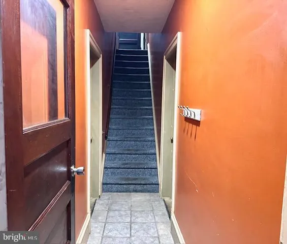 a view of living room with furniture and a rug