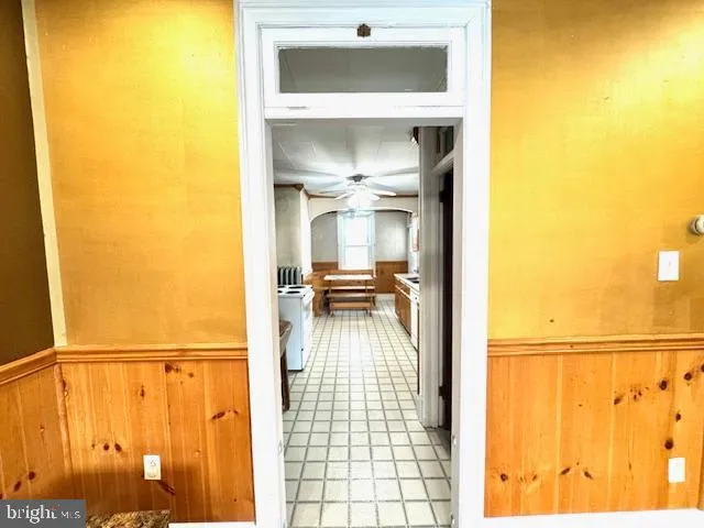 a kitchen with a sink appliances cabinets and furniture