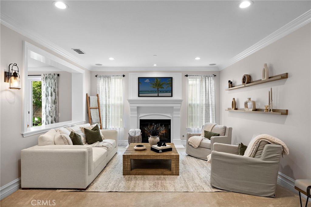 33 Christopher Street Ladera Ranch, CA 92694 - Photo 11 of 58 a living room with furniture fireplace and window