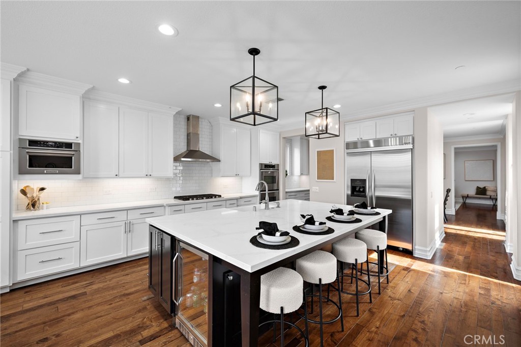 33 Christopher Street Ladera Ranch, CA 92694 - Photo 16 of 58 a kitchen with sink cabinets and wooden floor