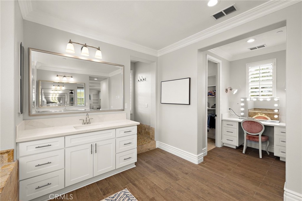33 Christopher Street Ladera Ranch, CA 92694 - Photo 30 of 58 a spacious bathroom with a double vanity sink a mirror and a shower