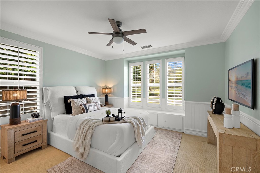 33 Christopher Street Ladera Ranch, CA 92694 - Photo 33 of 58 a bedroom with a large bed and a flat tv screen on dresser