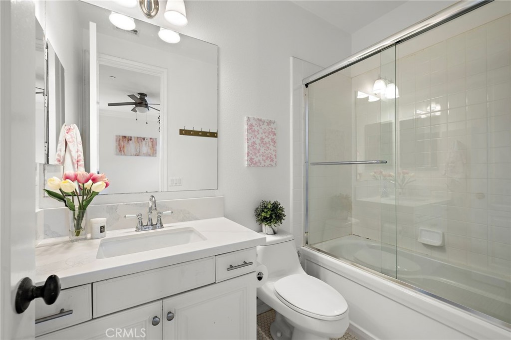 33 Christopher Street Ladera Ranch, CA 92694 - Photo 37 of 58 a bathroom with a sink vanity mirror and toilet