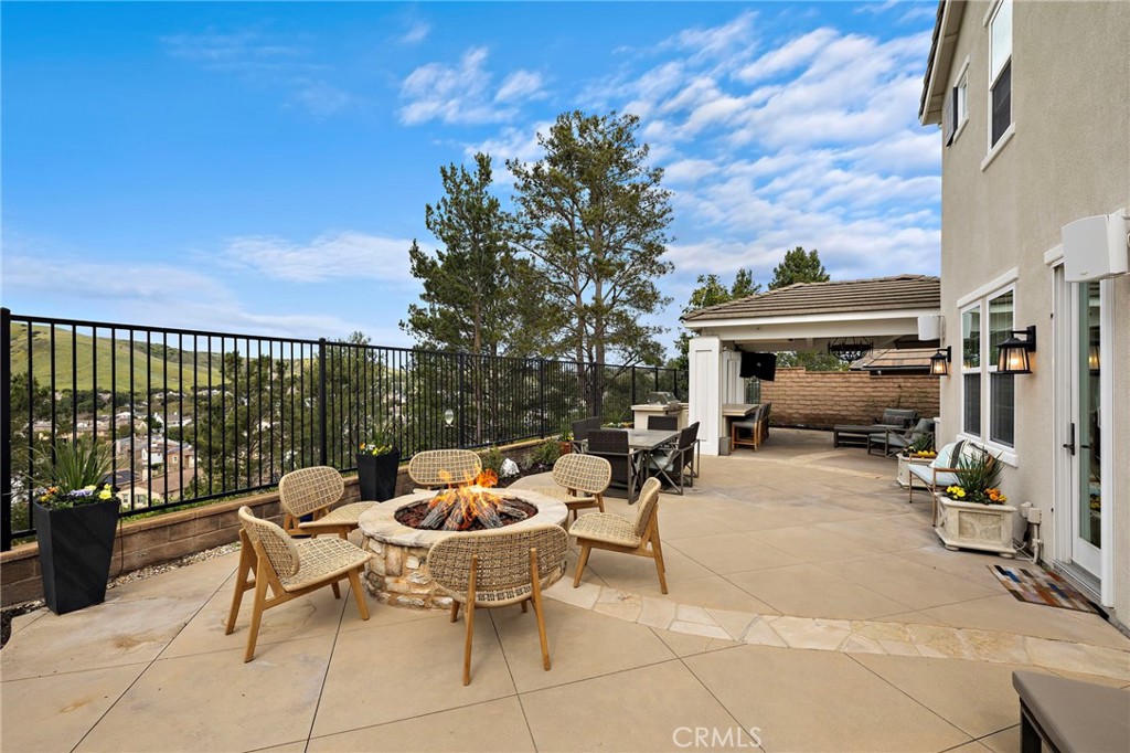 33 Christopher Street Ladera Ranch, CA 92694 - Photo 43 of 58 a view of a patio with a dining table and chairs with a patio