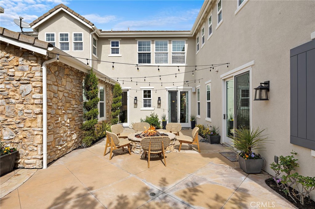 33 Christopher Street Ladera Ranch, CA 92694 - Photo 45 of 58 a building outdoor space with patio furniture and potted plants