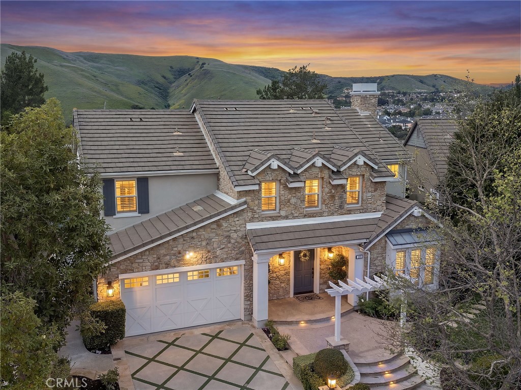 33 Christopher Street Ladera Ranch, CA 92694 - Photo 5 of 58 a front view of a house with a yard