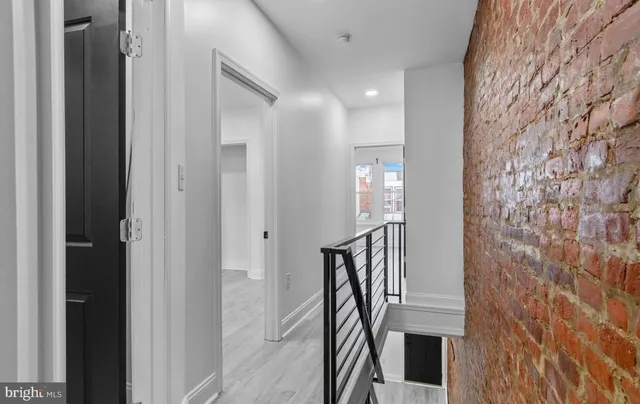 a view of entryway with wooden floor