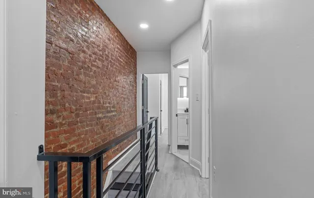 a bathroom with a granite countertop shower and a sink