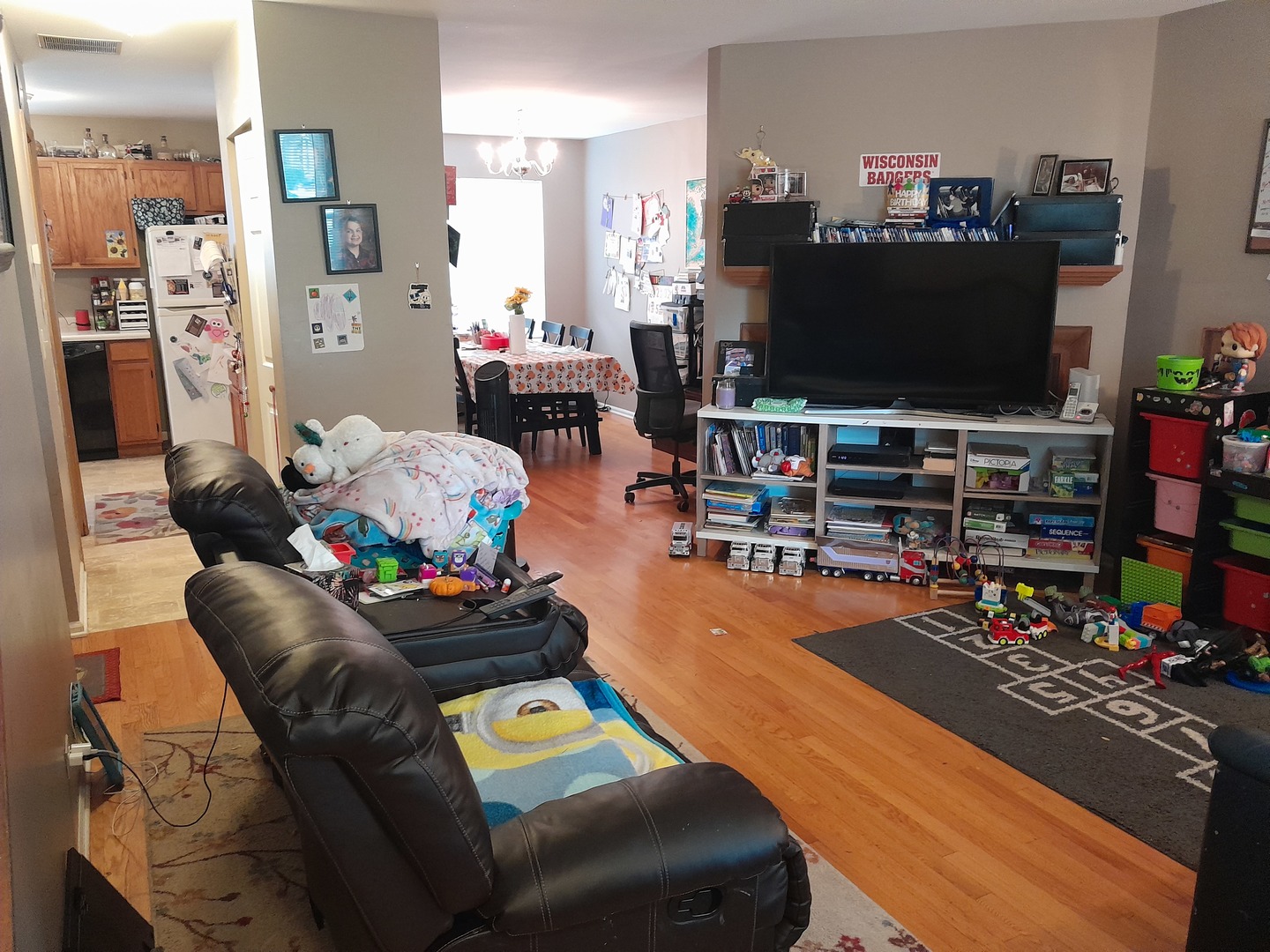 821 Perry Drive Algonquin, IL 60102 - Photo 2 of 21 a living room with furniture and a flat screen tv