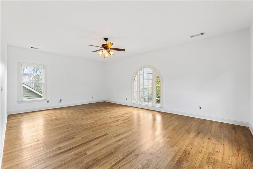 6645 Will Allen Road Cumming, GA 30040 - Photo 43 of 62 wooden floor in an empty room with a window