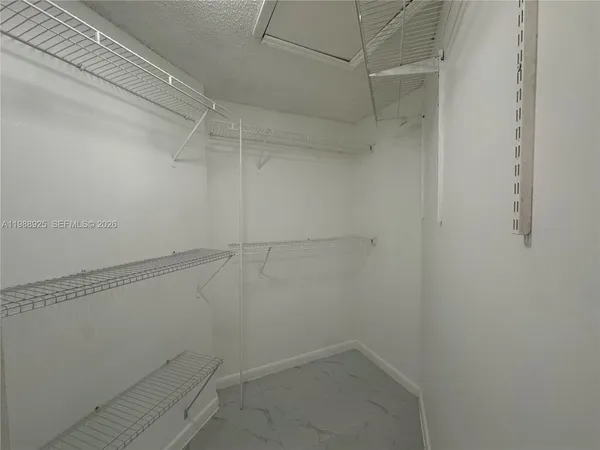 a white toilet sitting next to a bath tub