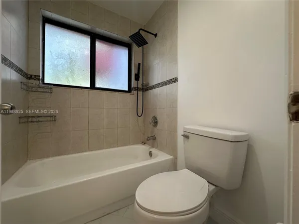 a bathroom with a bath tub