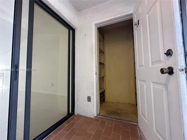 a view of a balcony with wooden floor