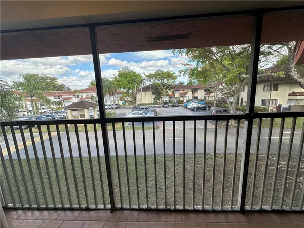 a potted plant sitting in front of a house