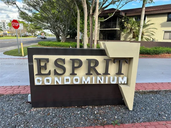 a view of a backyard with dishwasher and a garden