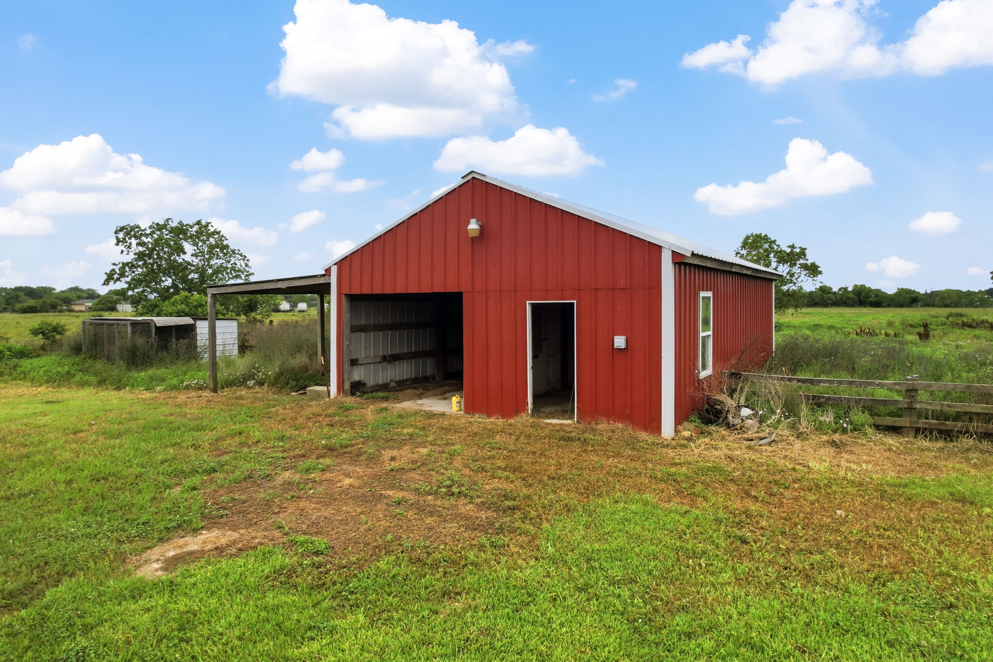 1405 Big Hill Road Winnie, TX 77665 - Photo 8 of 43 a front view of a house with a yard
