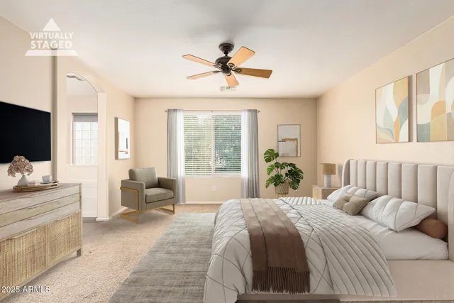 a spacious bedroom with a bed and glass walk in closet