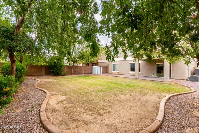 a view of a park with a bench and table
