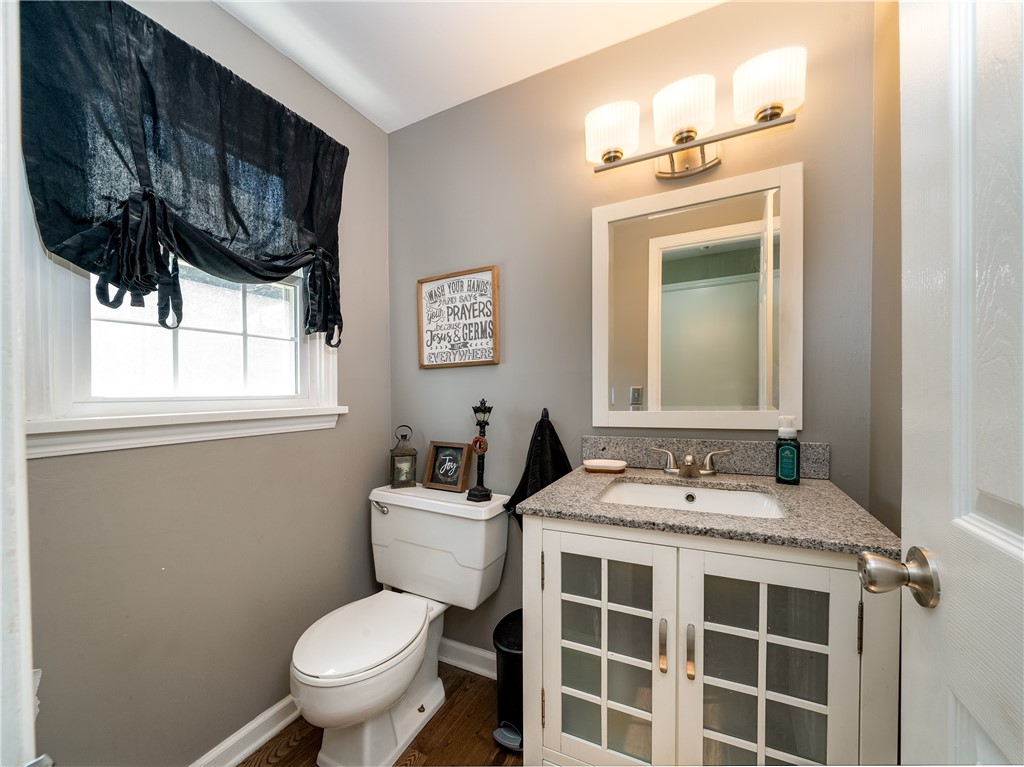 52 Lambeth Loop Perinton, NY 14450 - Photo 11 of 34 First floor half bath located off of the family ro