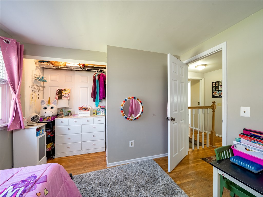 52 Lambeth Loop Perinton, NY 14450 - Photo 18 of 34 Bedroom showing closet size and looking out to lan