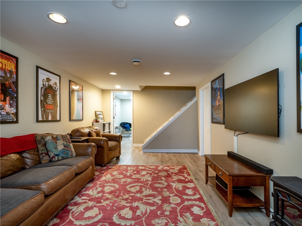 52 Lambeth Loop Perinton, NY 14450 - Photo 26 of 34 Rec room looking back to stairway and smaller fini
